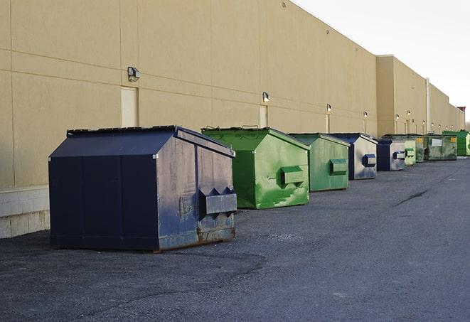 brightly colored dumpsters filled with construction waste in Harlingen